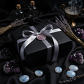Lavender crescent moon wax sealed box on dark silk with amethyst and dried lavender